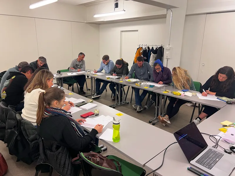 Workshop participants working through a practical AI exercise