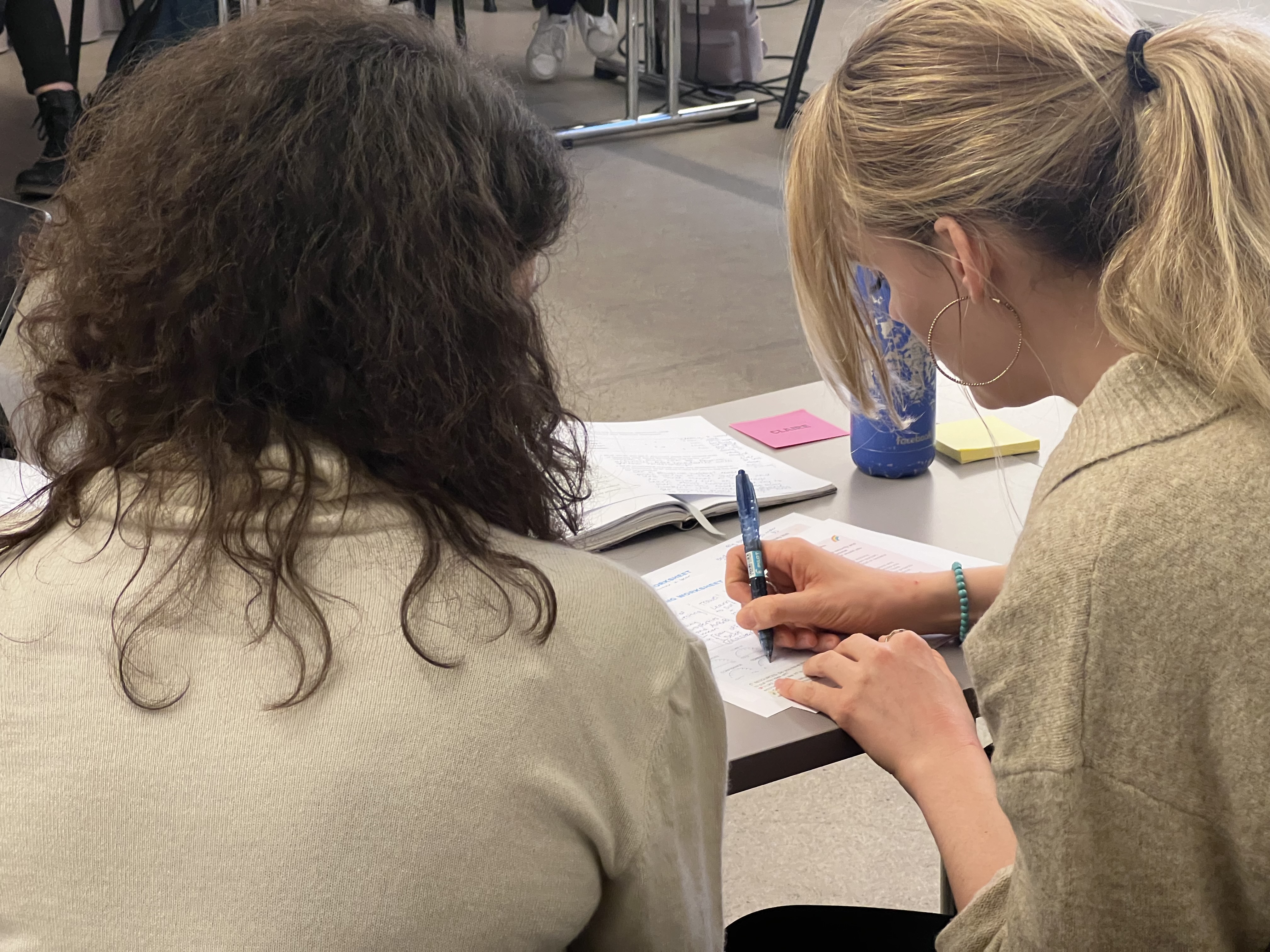 Workshop participants engaged in hands-on AI exercises in Lausanne